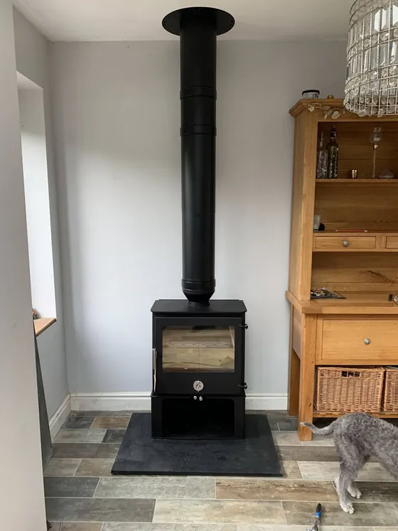 Wood burner on a slate hearth in a cottage living room