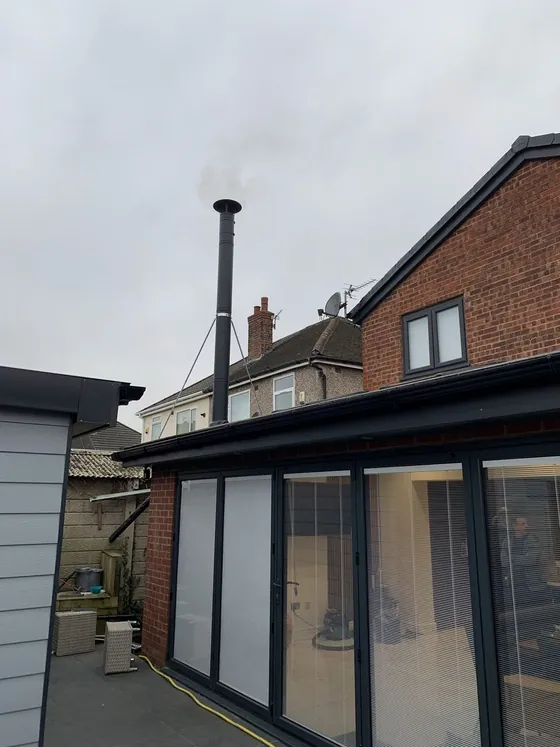 Home extension with a completed stove installation inside
