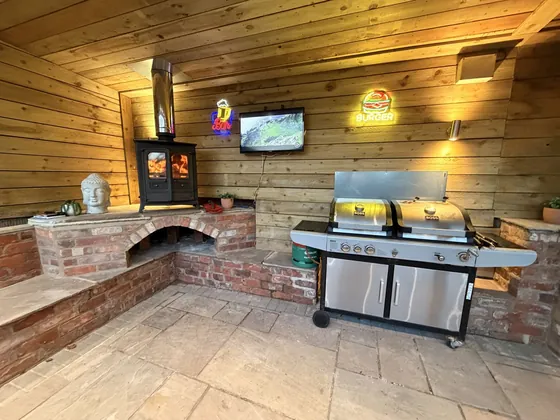 Outdoor brick fireplace and cooking area built by Riley Stoves & Sweeps